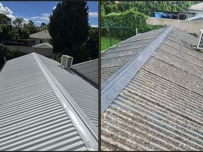 New Colorbond metal sheets being installed on a Sydney home with old tiles stripped off